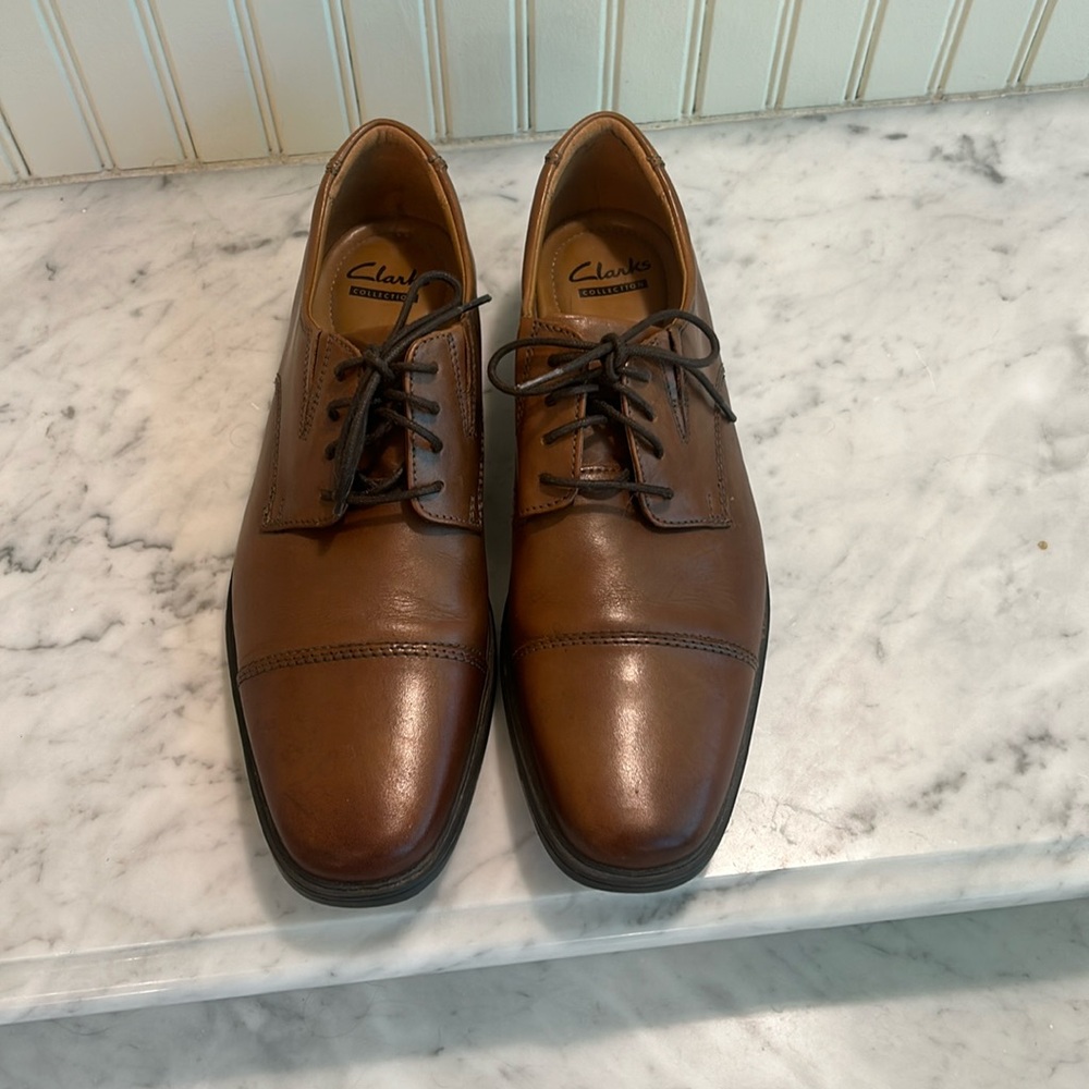 Clarks cap toe Oxford shoes.  Soft cushion with ortholite insoles.